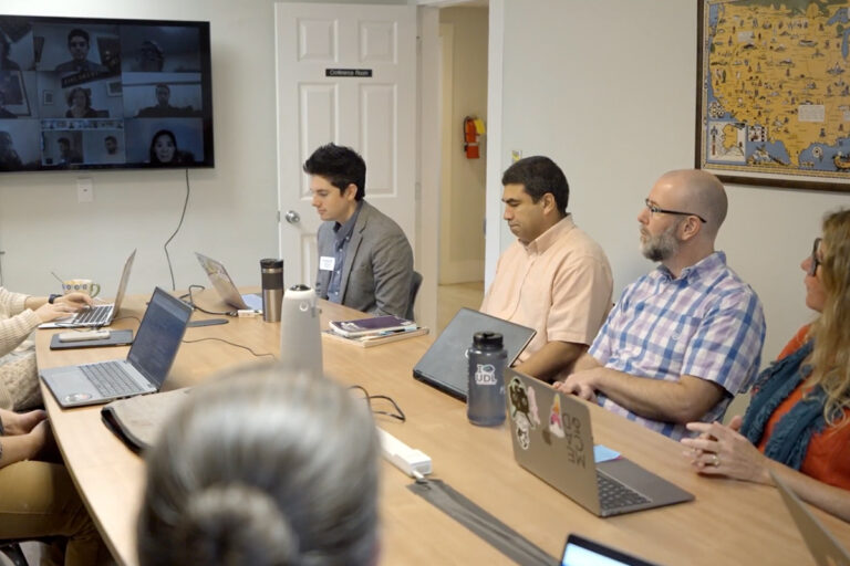 group of adults in conference room