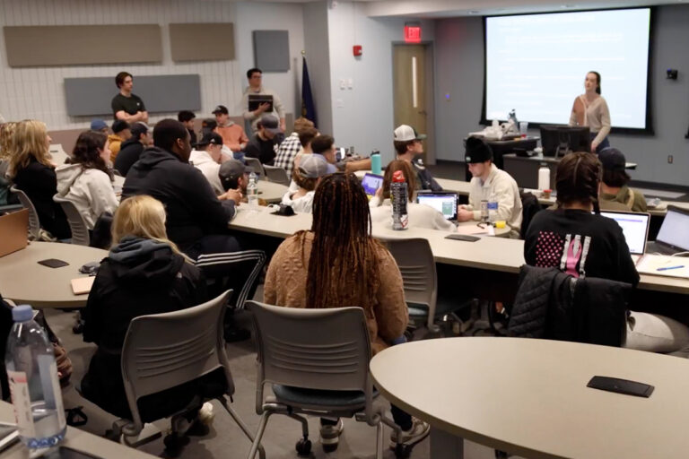 student giving a conference to people